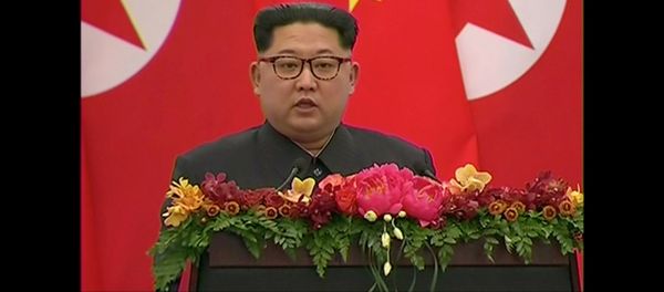 North Korean leader Kim Jong Un speaks during a banquet in Beijing, China - Sputnik International