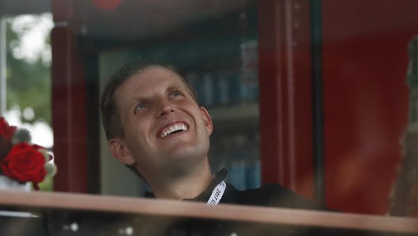 Eric Trump, the son of President Donald Trump, looks out from the presidential viewing stand, Friday, July 14, 2017, at Trump National Golf Club in Bedminster, N.J.  - Sputnik International