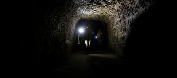 A member of Syrian forces of President Bashar al Assad walks inside a tunnel that was used by rebels in Jobar, eastern Ghouta, in Damascus, Syria April 2, 2018 A member of Syrian forces of President Bashar al Assad walks inside a tunnel that was used by rebels in Jobar, eastern Ghouta, in Damascus, Syria April 2, 2018 - Sputnik International