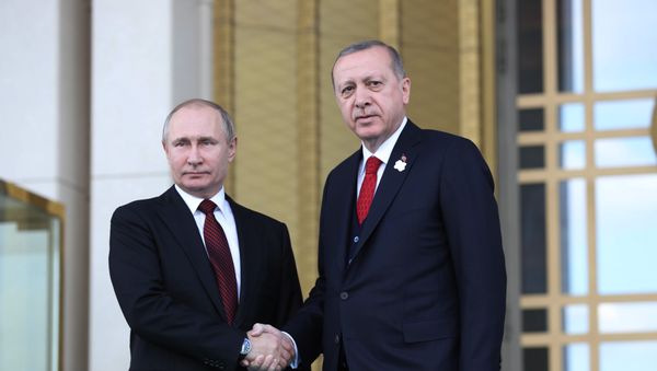 Turkish President Tayyip Erdogan shakes hands with his Russian counterpart Vladimir Putin during a welcoming ceremony at the Presidential Palace in Ankara on April 3, 2018 Turkish President Tayyip Erdogan shakes hands with his Russian counterpart Vladimir Putin during a welcoming ceremony at the Presidential Palace in Ankara on April 3, 2018 - Sputnik International