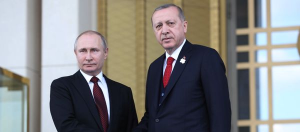 Turkish President Tayyip Erdogan shakes hands with his Russian counterpart Vladimir Putin during a welcoming ceremony at the Presidential Palace in Ankara on April 3, 2018 Turkish President Tayyip Erdogan shakes hands with his Russian counterpart Vladimir Putin during a welcoming ceremony at the Presidential Palace in Ankara on April 3, 2018 - Sputnik International
