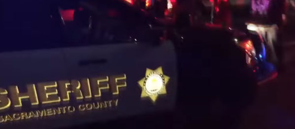 Woman hit by police car during Stephon Clark protest in Sacramento, US Woman hit by police car during Stephon Clark protest in Sacramento, US - Sputnik International
