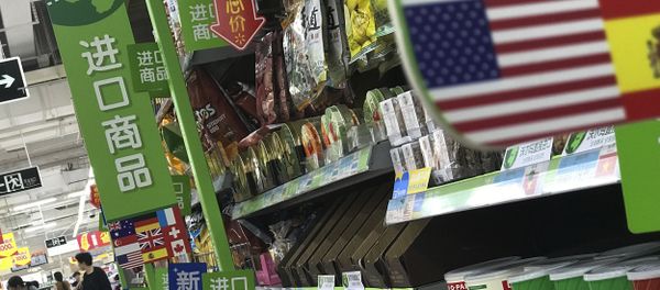 Women push a shopping cart near nuts and sweets imported from the United States and other countries displayed on a section selling imported foods at a supermarket in Beijing, Monday, April 2, 2018 Women push a shopping cart near nuts and sweets imported from the United States and other countries displayed on a section selling imported foods at a supermarket in Beijing, Monday, April 2, 2018 - Sputnik International