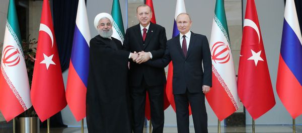Russian President Vladimir Putin, Turkish President Recep Tayyip Erdogan and Iranian President Hassan Rouhani, right to left, pose for a photo before a meeting in Ankara Russian President Vladimir Putin, Turkish President Recep Tayyip Erdogan and Iranian President Hassan Rouhani, right to left, pose for a photo before a meeting in Ankara - Sputnik International