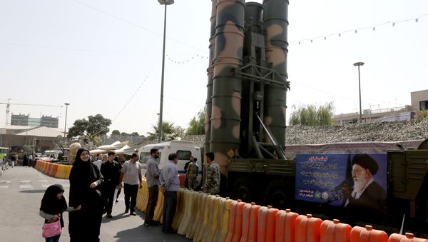 People walk past a Russian-made S-300 air defence system displayed on Baharestan square in Tehran on September 25, 2017 People walk past a Russian-made S-300 air defence system displayed on Baharestan square in Tehran on September 25, 2017 - Sputnik International