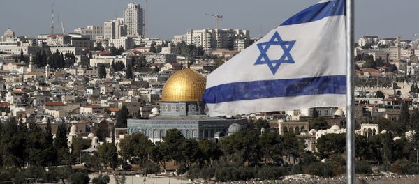 The Israeli flag flutters in front of the Dome of the Rock mosque and the city of Jerusalem, on December 1, 2017 - Sputnik International