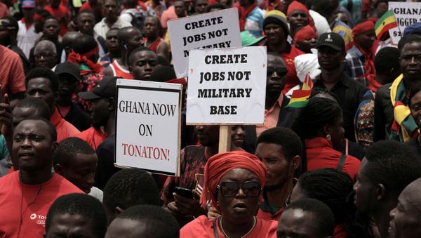Demonstrators carry banners as they march during a protest in Ghana's capital Accra against the expansion of its defence cooperation with the United States, Ghana March 28, 2018. Demonstrators carry banners as they march during a protest in Ghana's capital Accra against the expansion of its defence cooperation with the United States, Ghana March 28, 2018. - Sputnik International