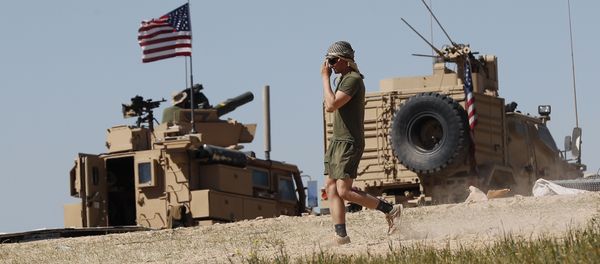 A US soldier walks on a newly installed position, near the tense front line between the US-backed Syrian Manbij Military Council and the Turkish-backed fighters, in Manbij, north Syria, April 4, 2018 A US soldier walks on a newly installed position, near the tense front line between the US-backed Syrian Manbij Military Council and the Turkish-backed fighters, in Manbij, north Syria, April 4, 2018 - Sputnik International