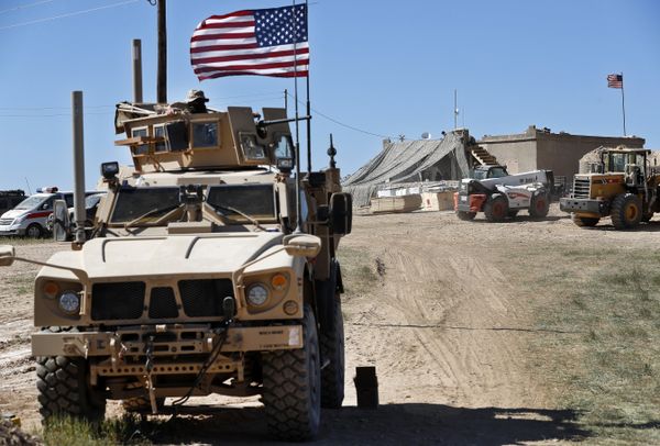 A U.S. soldier, left, sits on an armored vehicle behind a sand barrier at a newly installed position near the tense front line between the U.S-backed Syrian Manbij Military Council and the Turkish-backed fighters, in Manbij, north Syria, Wednesday, April 4, 2018 A U.S. soldier, left, sits on an armored vehicle behind a sand barrier at a newly installed position near the tense front line between the U.S-backed Syrian Manbij Military Council and the Turkish-backed fighters, in Manbij, north Syria, Wednesday, April 4, 2018 - Sputnik International