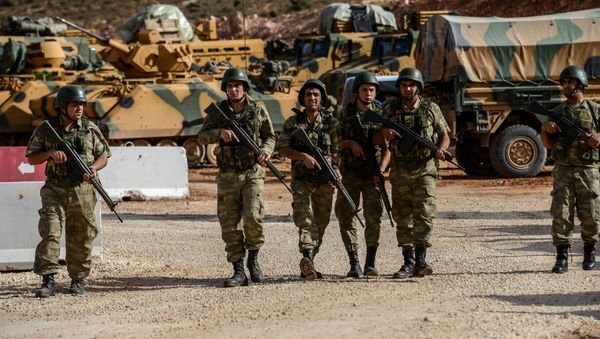 Turkish soldiers stand near armoured vehicles during a demonstration in support of the Turkish army's Idlib operation near the Turkey-Syria border near Reyhanli, Hatay, on October 10, 2017 - Sputnik International