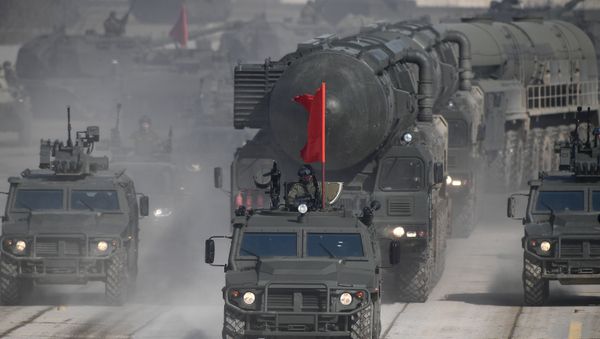 Tigr armored vehicles and a Yars land-based mobile missile system during a Victory Day Military Parade rehearsal at the Alabino military training ground in the Moscow Region - Sputnik International