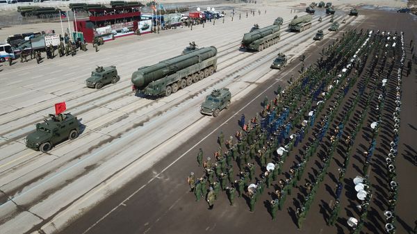 Tigr armored vehicles with Arbalet remote controlled weapon stations and RS-24 Yars transporter-launcher containers during a Victory Day Military Parade rehearsal at the Alabino military training ground in the Moscow Region - Sputnik International