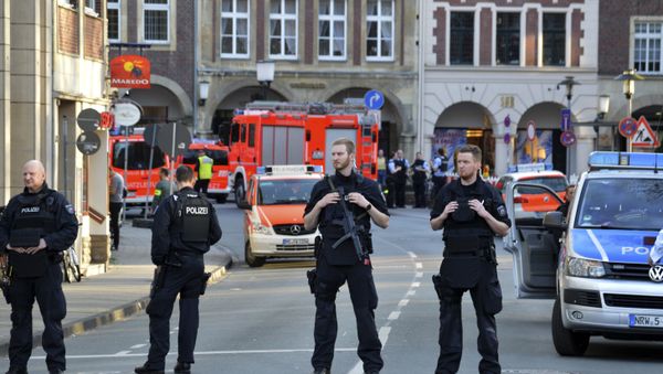 Police officers secure the crime scene after a car crashed into a group of people leaving several dead in Muenster, Germany, Saturday, April 7, 2018. - Sputnik International