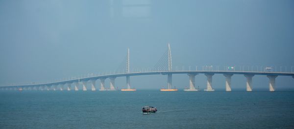 A boat sails in front of the Hong Kong-Zhuhai-Macau Bridge, to be opened in Zhuhai, China March 28, 2018 A boat sails in front of the Hong Kong-Zhuhai-Macau Bridge, to be opened in Zhuhai, China March 28, 2018 - Sputnik International