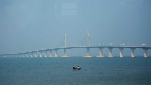 A boat sails in front of the Hong Kong-Zhuhai-Macau Bridge, to be opened in Zhuhai, China March 28, 2018 A boat sails in front of the Hong Kong-Zhuhai-Macau Bridge, to be opened in Zhuhai, China March 28, 2018 - Sputnik International