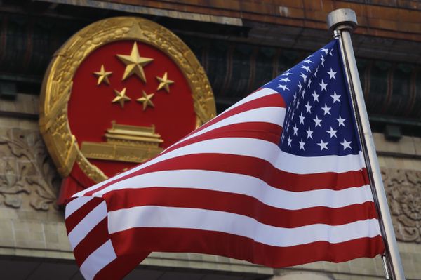 FILE - In this Nov. 9, 2017 file photo, an American flag is flown next to the Chinese national emblem during a welcome ceremony for visiting U.S. President Donald Trump outside the Great Hall of the People in Beijing FILE - In this Nov. 9, 2017 file photo, an American flag is flown next to the Chinese national emblem during a welcome ceremony for visiting U.S. President Donald Trump outside the Great Hall of the People in Beijing - Sputnik International