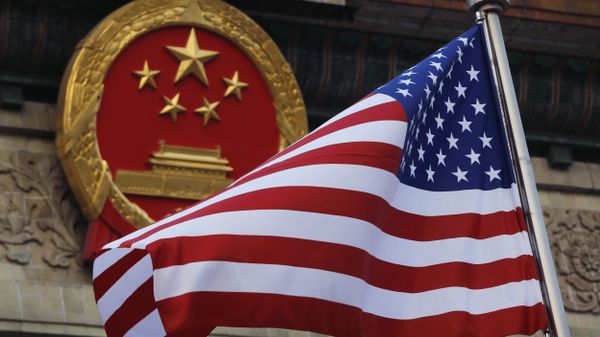 FILE - In this Nov. 9, 2017 file photo, an American flag is flown next to the Chinese national emblem during a welcome ceremony for visiting U.S. President Donald Trump outside the Great Hall of the People in Beijing FILE - In this Nov. 9, 2017 file photo, an American flag is flown next to the Chinese national emblem during a welcome ceremony for visiting U.S. President Donald Trump outside the Great Hall of the People in Beijing - Sputnik International