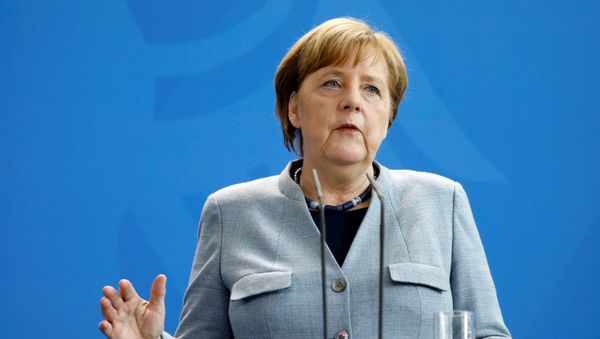 German Chancellor Angela Merkel speaks during a joint press conference with Ukraine's President after talks about fragile truce on April 10, 2018 in Berlin German Chancellor Angela Merkel speaks during a joint press conference with Ukraine's President after talks about fragile truce on April 10, 2018 in Berlin - Sputnik International