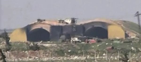 This frame grab from video provided by the Syrian official TV, a Syrian government channel that is consistent with independent AP reporting, shows the burned and damaged hangar warplanes which attacked by U.S. Tomahawk missiles, at the Shayrat Syrian government forces airbase, southeast of Homs, Syria, early Friday April, 7, 2017 - Sputnik International
