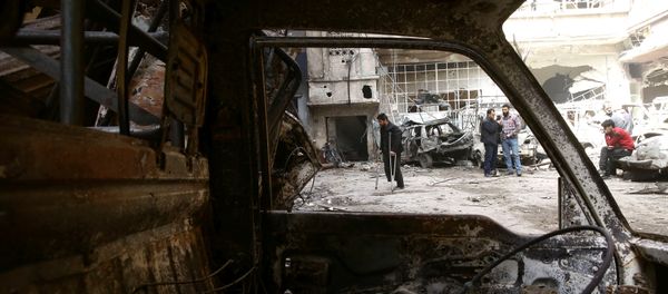 A man on crutches walks at a damaged site in the besieged town of Douma, Eastern Ghouta, in Damascus, Syria March 21, 2018 A man on crutches walks at a damaged site in the besieged town of Douma, Eastern Ghouta, in Damascus, Syria March 21, 2018 - Sputnik International
