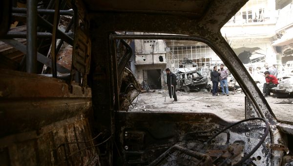 A man on crutches walks at a damaged site in the besieged town of Douma, Eastern Ghouta, in Damascus, Syria March 21, 2018 - Sputnik International