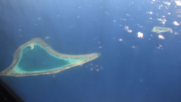 Aerial view of reefs in the disputed Spratly islands. (File) Aerial view of reefs in the disputed Spratly islands. (File) - Sputnik International