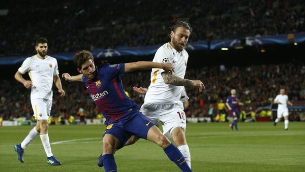 Barcelona's Sergi Roberto, left, challenges for the ball with Roma's Daniele de Rossi during a Champions League quarter-final, first leg soccer match between FC Barcelona and Roma at the Camp Nou stadium in Barcelona, Spain, Wednesday, April 4, 2018 Barcelona's Sergi Roberto, left, challenges for the ball with Roma's Daniele de Rossi during a Champions League quarter-final, first leg soccer match between FC Barcelona and Roma at the Camp Nou stadium in Barcelona, Spain, Wednesday, April 4, 2018 - Sputnik International