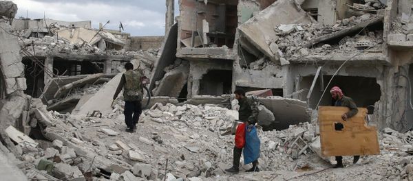 People walk on rubble of damaged buildings in the besieged town of Douma, Eastern Ghouta, in Damascus, Syria People walk on rubble of damaged buildings in the besieged town of Douma, Eastern Ghouta, in Damascus, Syria - Sputnik International