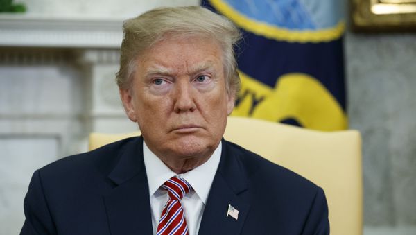 President Donald Trump listens during a meeting with the Emir of Qatar Sheikh Tamim bin Hamad al-Thani in the Oval Office of the White House, Tuesday, April 10, 2018, in Washington - Sputnik International