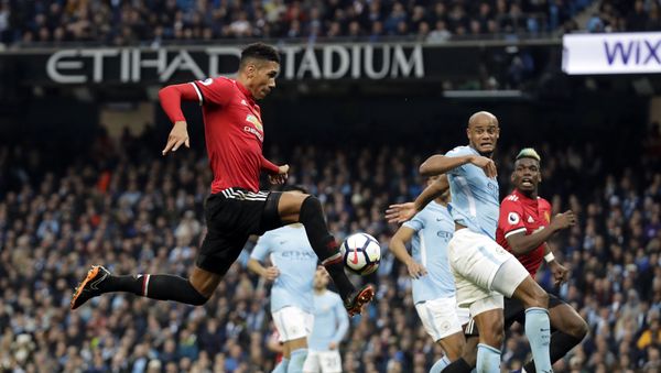 Manchester United's Chris Smalling, left, scores his side's third goal during the English Premier League soccer match between Manchester City and Manchester United at the Etihad Stadium in Manchester, England, Saturday April 7, 2018 Manchester United's Chris Smalling, left, scores his side's third goal during the English Premier League soccer match between Manchester City and Manchester United at the Etihad Stadium in Manchester, England, Saturday April 7, 2018 - Sputnik International