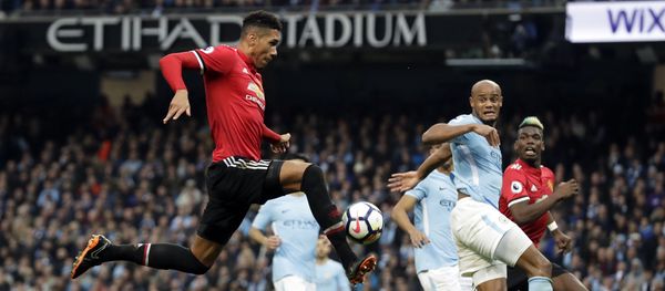 Manchester United's Chris Smalling, left, scores his side's third goal during the English Premier League soccer match between Manchester City and Manchester United at the Etihad Stadium in Manchester, England, Saturday April 7, 2018 Manchester United's Chris Smalling, left, scores his side's third goal during the English Premier League soccer match between Manchester City and Manchester United at the Etihad Stadium in Manchester, England, Saturday April 7, 2018 - Sputnik International