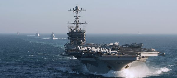 The aircraft carrier group of the United States Navy led by USS Harry S. Truman, front, and a ship escort are seen leaving the port of Norfolk heading for the Middle East - Sputnik International