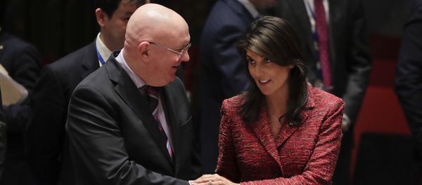 Russian Ambassador to the United Nations Vasily Nebenzya, left, and United States Ambassador to the U.N. Nikki Haley shake hands before a Security Council meeting, Tuesday, April 10, 2018, at U.N. headquarters - Sputnik International