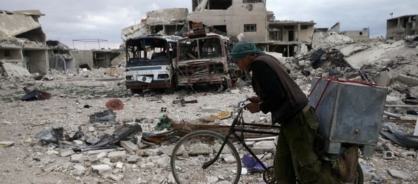 A man walks with his bicycle at a damaged site in the besieged town of Douma, Eastern Ghouta, in Damascus, Syria A man walks with his bicycle at a damaged site in the besieged town of Douma, Eastern Ghouta, in Damascus, Syria - Sputnik International