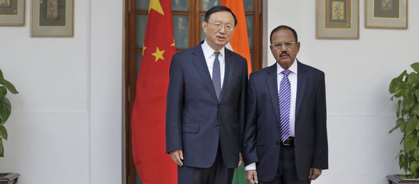 Indian National Security Adviser Ajit Doval, right, poses with Chinese State Councillor Yang Jiechi for photos before their meeting in New Delhi, India. (File) Indian National Security Adviser Ajit Doval, right, poses with Chinese State Councillor Yang Jiechi for photos before their meeting in New Delhi, India. (File) - Sputnik International