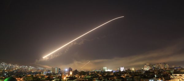 Damascus sky lights up with service to air missile fire as the U.S. launches an attack on Syria targeting different parts of the Syrian capital Damascus, Syria, early Saturday, April 14, 2018. - Sputnik International