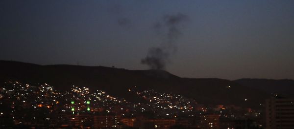 Smoke rises after airstrikes targeting different parts of the Syrian capital Damascus, Syria, early Saturday, April 14, 2018 - Sputnik International