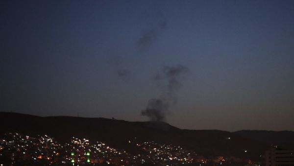 Smoke rises after airstrikes targeting different parts of the Syrian capital Damascus, Syria, early Saturday, April 14, 2018 - Sputnik International