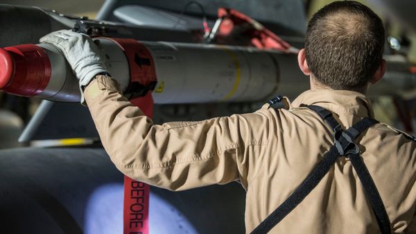In this image released by Britain's Ministry of Defense, a Tornado pilot checks the weapons on his Tornado at Britain Royal Air Force base in Akrotiri, Cyprus, after its mission to conduct strikes in support of operations over the Middle East Saturday, April 14, 2018 - Sputnik International