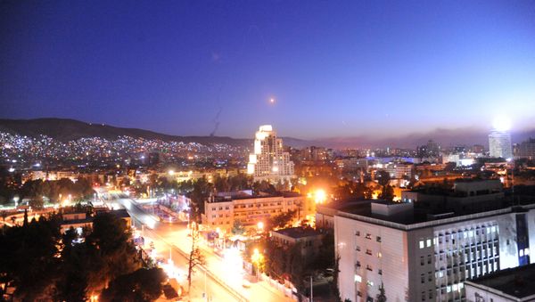 A missile is seen crossing over Damascus, Syria April 14, 2018 A missile is seen crossing over Damascus, Syria April 14, 2018 - Sputnik International
