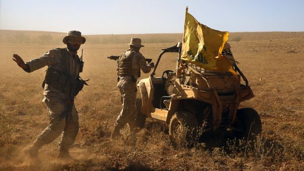 FILE - In this July 29, 2017 file photo,Hezbollah fighters stand near a four-wheel motorcycle positioned at the site where clashes erupted between Hezbollah and al-Qaida-linked fighters in Wadi al-Kheil or al-Kheil Valley in the Lebanon-Syria border - Sputnik International