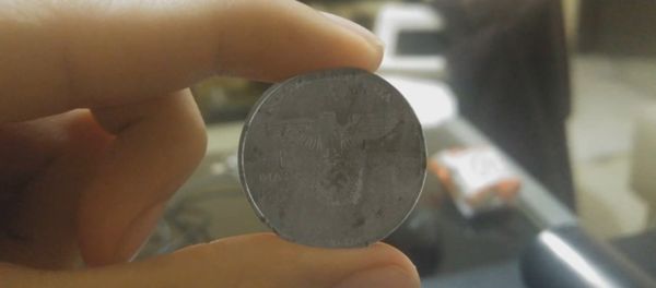 A video has emerged on YouTube to show what looked like a coin with the Reichsadler Nazi Party symbol and the words Nueva Alemania or New Germany A video has emerged on YouTube to show what looked like a coin with the Reichsadler Nazi Party symbol and the words Nueva Alemania or New Germany - Sputnik International