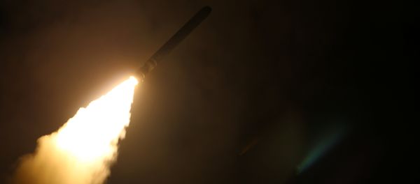 The U.S. Navy guided-missile cruiser USS Monterey fires a Tomahawk land attack missile April 14, 2018 - Sputnik International