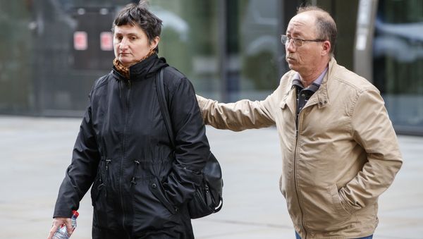 Sophie Lionnet's mother Catherine and her grandfather Stephane Devallone outside the court on Monday April 16 - Sputnik International