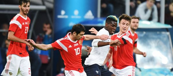 From left, first plan: Alan Dzagoyev (Russia), Paul Pogba (France) and Alexander Golovin (Russia) during the friendly match between Russia and France From left, first plan: Alan Dzagoyev (Russia), Paul Pogba (France) and Alexander Golovin (Russia) during the friendly match between Russia and France - Sputnik International