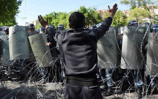 A demonstrator argues with riot police during a protest against Armenia's ruling Republican party's nomination of former President Serzh Sarksyan as its candidate for prime minister, in Yerevan, Armenia April 16, 2018. A demonstrator argues with riot police during a protest against Armenia's ruling Republican party's nomination of former President Serzh Sarksyan as its candidate for prime minister, in Yerevan, Armenia April 16, 2018. - Sputnik International