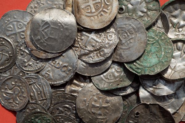 Saxon, Ottonian, Danish and Byzantine coins are pictured on a table in Schaprode, northern Germany on April 13, 2018. A 13-year-old boy and a hobby archaeologist have unearthed a significant trove in Germany which may have belonged to the legendary Danish king Harald Bluetooth who brought Christianity to Denmark Saxon, Ottonian, Danish and Byzantine coins are pictured on a table in Schaprode, northern Germany on April 13, 2018. A 13-year-old boy and a hobby archaeologist have unearthed a significant trove in Germany which may have belonged to the legendary Danish king Harald Bluetooth who brought Christianity to Denmark - Sputnik International