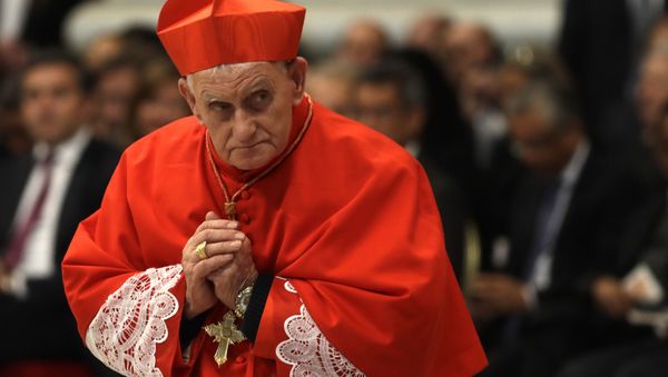 New cardinal Ernest Troshani Simoni, presbyter of the archdiocese of Shkoder-Pult, leaves after receiving the red three-cornered biretta hat during a consistory inside the St. Peter's Basilica at the Vatican, Saturday, Nov. 19, 2016 - Sputnik International