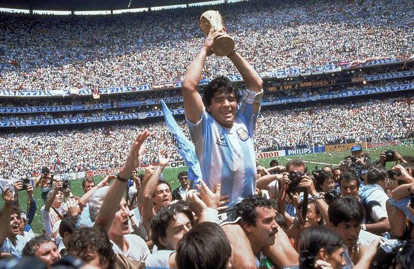 Diego Maradona of Argentina celebrates with the cup at the end of the World Cup soccer final in the Atzeca Stadium, in Mexico City, Mexico. (File) - Sputnik International