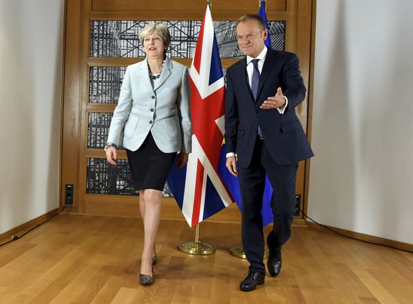 British Prime Minister Theresa May, left, walks with European Council President Donald Tusk prior to a meeting at the Europa building in Brussels on Friday, Dec. 8, 2017 - Sputnik International